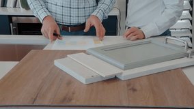 Young Couple Planning Kitchen Cabinet Renovation: Collaborative Design Process - Powered by Shutterstock - Get 15% off with code: PIKWIZARD15