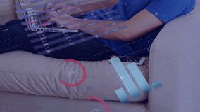 Animation of infographic interface, caucasian man working on laptop and talking on cellphone at home. Digital composite, multiple exposure, report, growth, progress, global and technology concept. - Powered by Shutterstock - Get 15% off with code: PIKWIZARD15