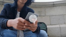 Animation of network of connections with icons over biracial man using smartphone. Global business, social media, digital interface and data processing concept digitally generated video. - Powered by Shutterstock - Get 15% off with code: PIKWIZARD15