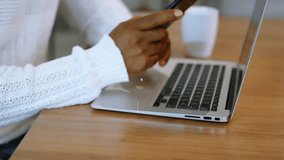 Animation of network of connections with icons over biracial businessman using smartphone. Global business, social media, digital interface and data processing concept digitally generated video. - Powered by Shutterstock - Get 15% off with code: PIKWIZARD15