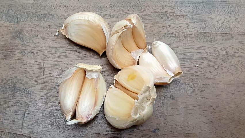 Close up of a collection of fresh garlic cloves. Garlic cloves from the air. Garlic market.