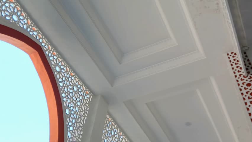 Beautiful mosaic decoration inside the mosque. Ornaments on the ceiling of a medieval mosque building. Mosque decoration.