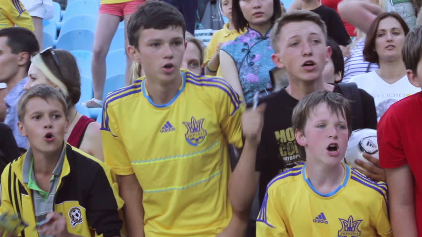 KIEV, UKRAINE - JUNE 13: Young football fans shout asking for autograph of