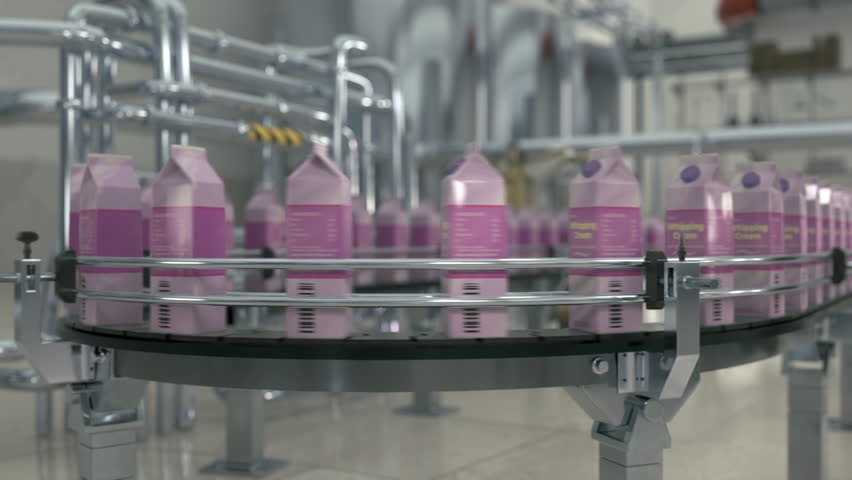 Factory equipment carrying lots of food packages on the conveyor line. Modern factory equipment packages the products in cartons. Factory equipment transporting the packaged whipping cream.