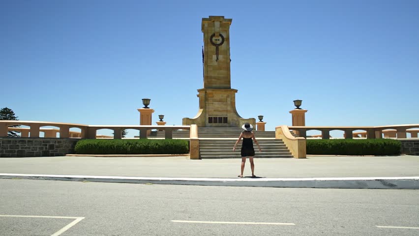 Tourist at the stairs leading to the Obelisk of the Fremantle War Memorial at Monument Hill overlooks Fremantle Harbor in Perth, Western Australia. The memorial commemorates World War I.
