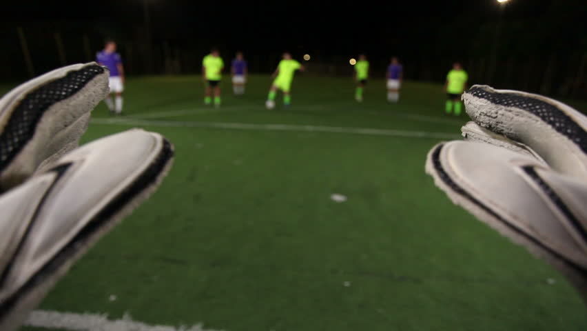 Soccer goalkeeper save (punch). POV of keeper. Football youth playing.