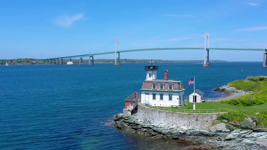 Epic view of the lighthouse in Rhode Island near the Pell Bridge in Newport Harbor and Coast