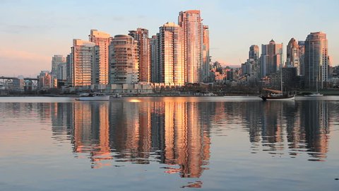 Yaletown, False Creek, Sunrise Reflection. Sunrise reflects off Yaletown condominiums in downtown Vancouver. British Columbia, Canada.
