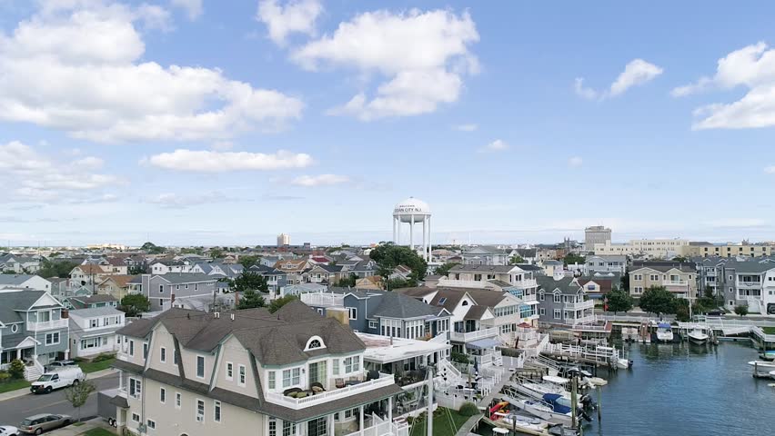Ocean City New Jersey water tower, bay, boats and vacation homes aerial on a summer day