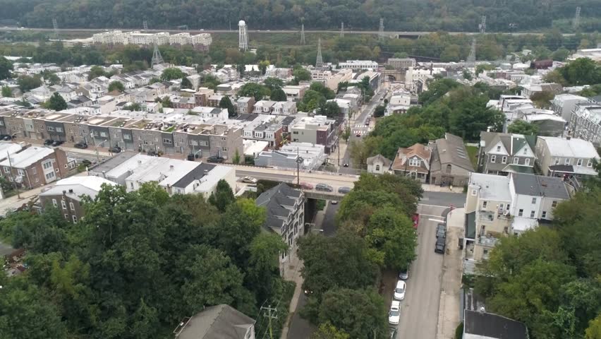 Aerial of row homes and streets in Manayunk Roxborough area of Philadelphia on a clear day