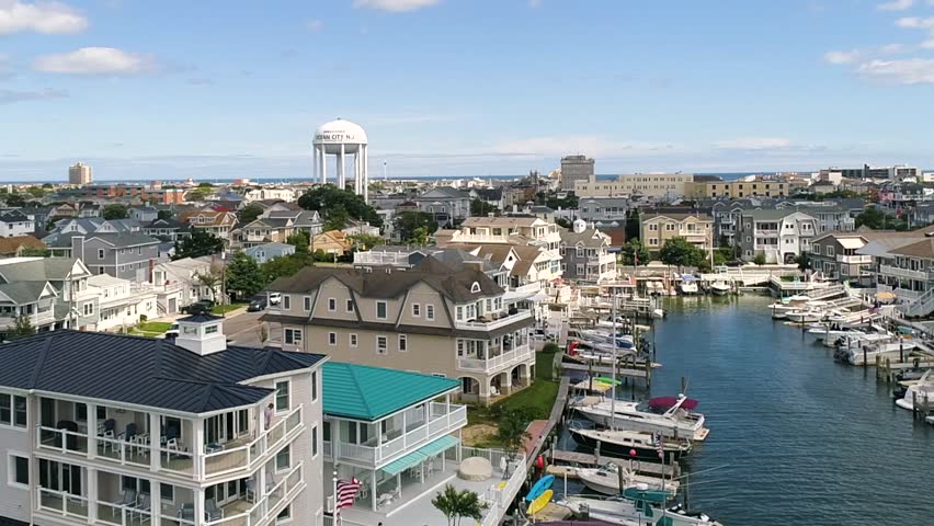 Ocean City New Jersey aerial on a summer day with vacation rentals on the bay water with boats