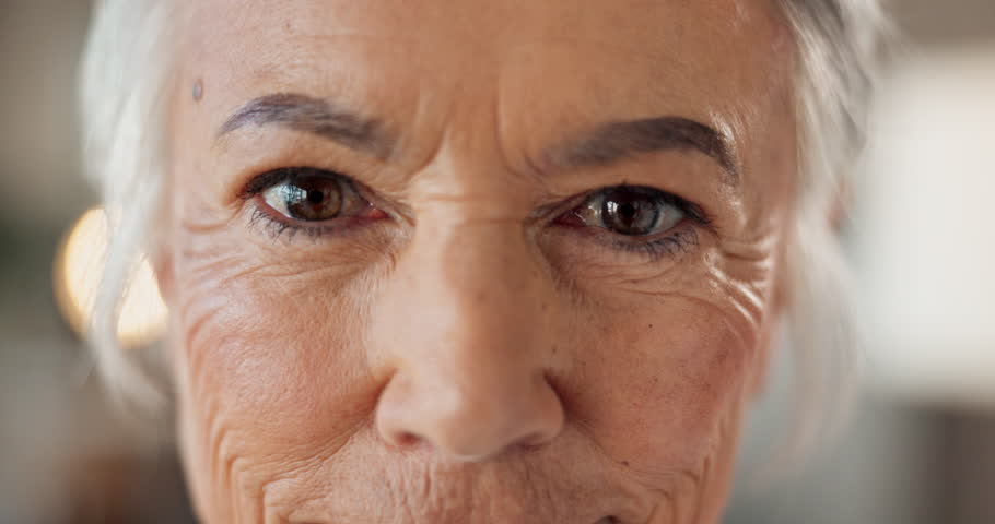 Senior, woman and closeup of eyes with skincare for anti aging treatment, collagen facial results and confidence. Beauty, portrait and cosmetics for wrinkles, skin hydration or dermatology with smile