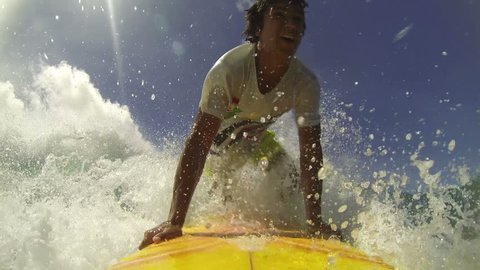 Professional surfer rides a tropical ocean wave