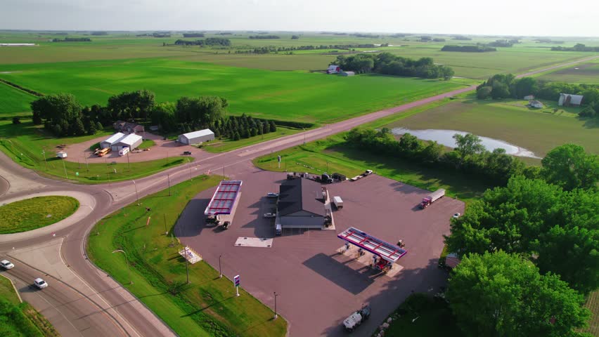 Aerial view of a truck stop in Minnesota, USA, featuring parked trucks and vehicles.