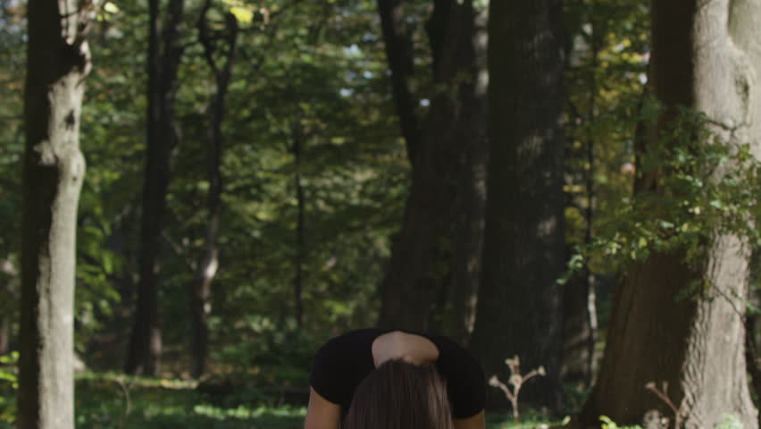 Beautiful girl with healthy long blonde hair outdoors on a sunny summer day. Happy smiling young woman enjoying wind and nature. Slow motion shot.