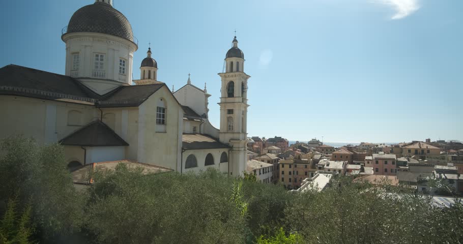 Lavagna, Liguria, Italy - Liguria landscape. Panorama of Lavagna. Church of Santo Stefano with olive trees, sky and skyline of the Ligurian town.