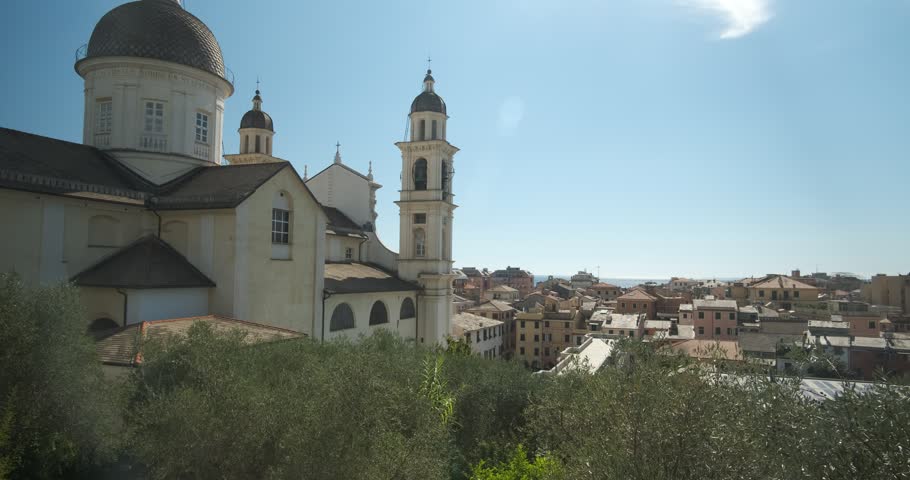Lavagna, Liguria, Italy - Lavagna landscape. Panorama of Lavagna. Church of Santo Stefano with olive trees, sky and skyline of the Ligurian town.