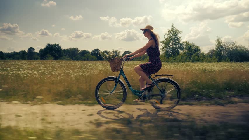 Carefree Girl Cyclist On Vacation. Bicycling On Holidays. Pretty Girl Having Fun. Calm Bicycle Adventure. Woman Cyclist Riding Road Bike. Cycling Leisure And Hobbies. Cyclist Woman Riding Bike In Park