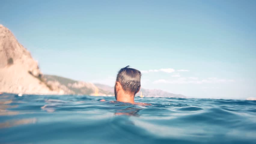 Swimming On Mediterranean Sea Beach. Cinematic Inspiration Travel Holiday Trip. Fresh Sea Breeze Summertime Vacation Vibes. Wanderlust Explorer Have Great Time Mood. Happy Tourist On Greek Island