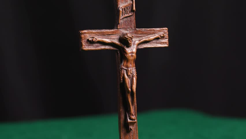 Wooden Jesus on cross Christianity symbol turning 1