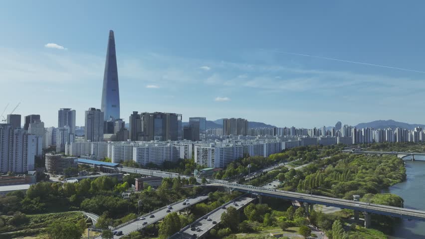 Drone View of Seoul city in South Korea, Jamsil Han River, Summer 60fps