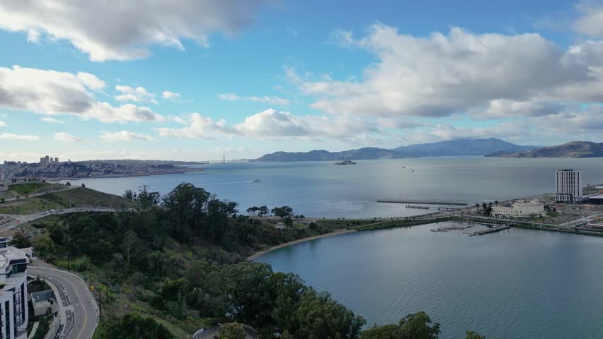 A smooth horizontal drone push-in towards Treasure Isle Marina at Yerba Buena Island, CA. Captures the marina, boats, and scenic waterfront. Perfect for coastal, travel, or marine-themed footage.