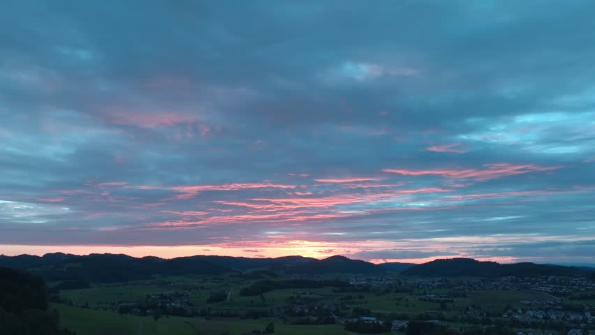 Aerial view of landscape with sunset after rainstorm with darks clouds.