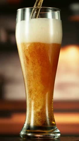 Super Slow Motion of Pouring Beer into Pint. Filmed on High Speed Cinema Camera, 1000 fps. Vertical Aspect Ratio.