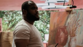 African american painter recording a video and self advertising masterpiece, using social media to promote art and create a branding as an influencer. Documenting artistic process. Camera A. - Powered by Shutterstock - Get 15% off with code: PIKWIZARD15