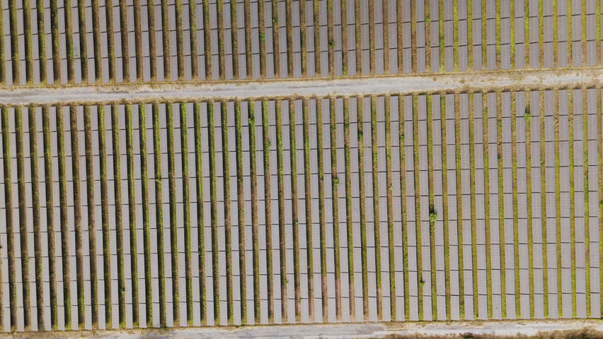 Drone footage scenic landscape of Solar panels in a solar farm Producing electricity with clean energy alternative energy - Powered by Shutterstock - Get 15% off with code: PIKWIZARD15