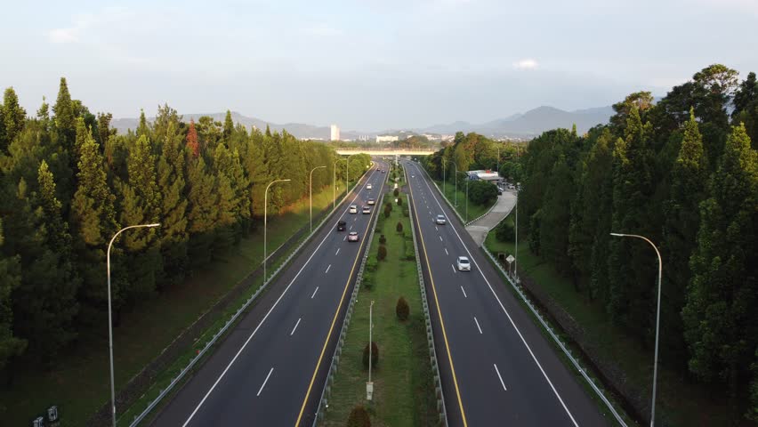 Aerial view of multi-lane highway. Fly over the big highway. Car driving on modern road top view