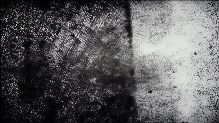 Heavy distressed black surface grunge overlay with deep cracks and raw analog film grain, perfect for edgy music promos, trailers, and textured motion graphics.