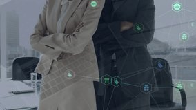 Animation of network of connections with icons over diverse business people. Global finance, business, connections, computing and data processing concept digitally generated video. - Powered by Shutterstock - Get 15% off with code: PIKWIZARD15