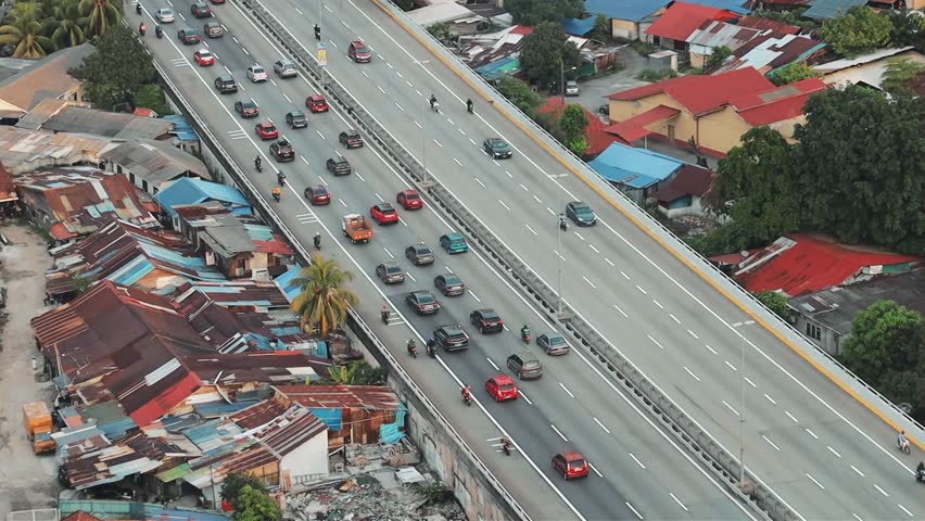 Aerial view of the traffic jam on the highway cars moving on the road in Kuala Lumpur, Malaysia