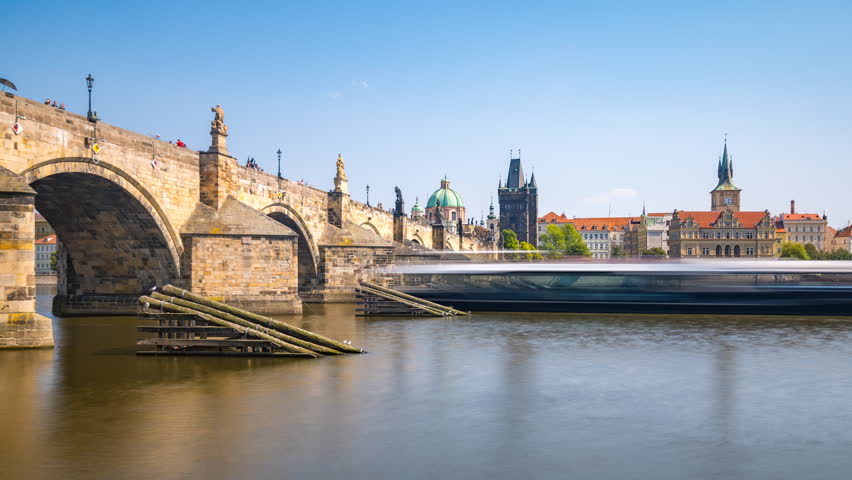 Medieval Stone Arch Bridge Of Charles Bridge Over Vltava River In Prague, Czech Republic Time Lapse, Hyperlapse footage od prague river bridge and old town.