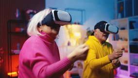 Comic senior couple putting VR headsets on, playing boxing interactive game - Powered by Shutterstock - Get 15% off with code: PIKWIZARD15
