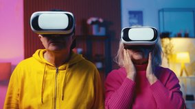 Surprised senior couple experiencing virtual reality simulation in VR headsets - Powered by Shutterstock - Get 15% off with code: PIKWIZARD15