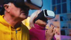 Excited senior man and his wife wearing VR goggles, enjoying virtual reality - Powered by Shutterstock - Get 15% off with code: PIKWIZARD15