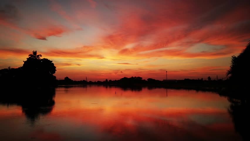 sunset or sunrise landscape Amazing light of nature cloudscape sky and Clouds moving away rolling 4k colorful dark sunset  Epic cloudscape Nature view