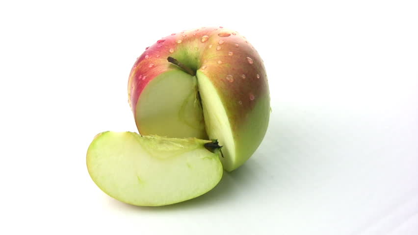 Natural fresh juicy apple with a truncated segment rotates, showing itself on