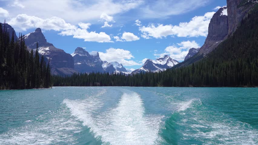 Maligne Lake Cruise to the famous Spirit Island. Jasper National Park summer scenery, snow-capped mountains and turquoise lakes. Alberta, Canada. Canadian Rockies.