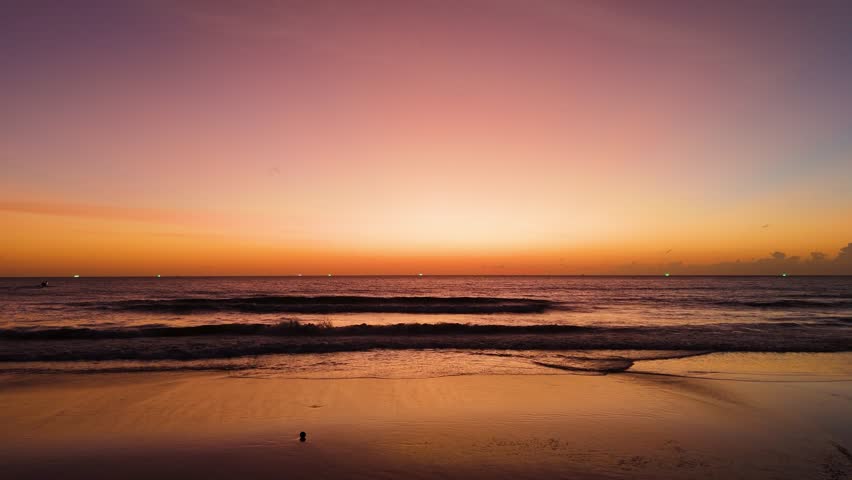 Aerial view of sunset Cinematic drone aerial view beautiful evening sunset in sky over sea.Beautiful ocean during sunset in summer. Ocean with an sun on the horizon while orange color sunset. Beautifu