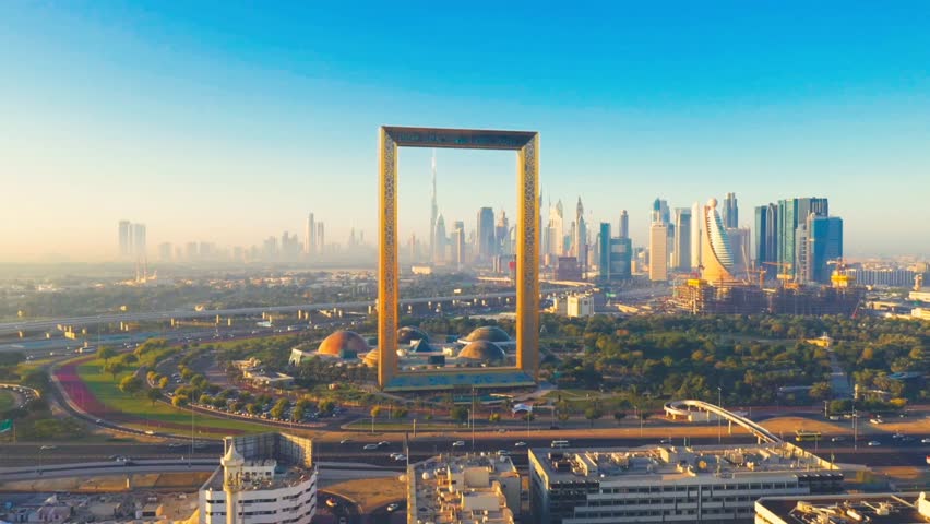 Aerial view of Dubai Frame, Downtown skyline, United Arab Emirates or UAE. drone passing the Iconic Dubai Frame.