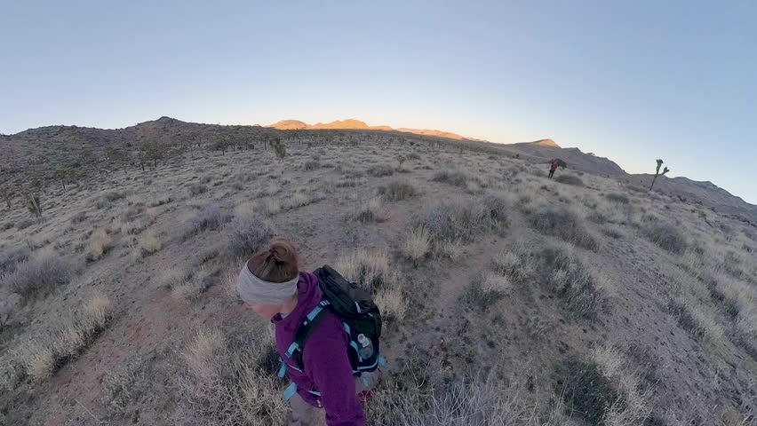 Dusk Comes in Over Couple Hiking in Joshua Tree National Park