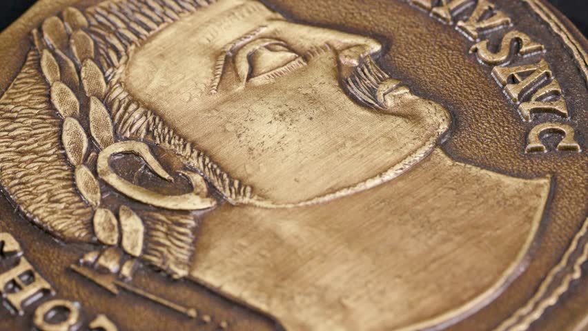 Close up Constantine cross coin design turning