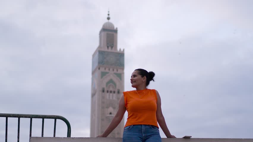 Beautiful middle aged woman visiting Hassan II Mosque in Casablanca Morocco posing for pictures_3.MOV