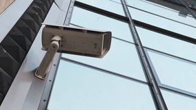 Surveillance camera in a commercial building ensures safety protection, with technology for urban safety and monitoring - Powered by Shutterstock - Get 15% off with code: PIKWIZARD15