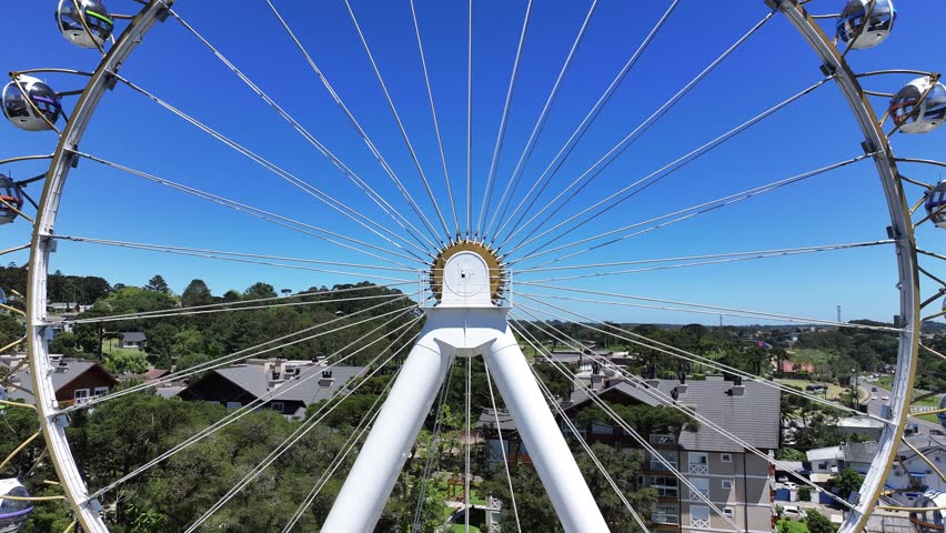 Stunning Ferris Wheel At Canela In Rio Grande Do Sul Brazil. Stunning Ferris Wheel. Cityscape Scenery. Traffic Avenue. Canela Brazil. Stunning Ferris Wheel At Canela In Rio Grande Do Sul Brazil.