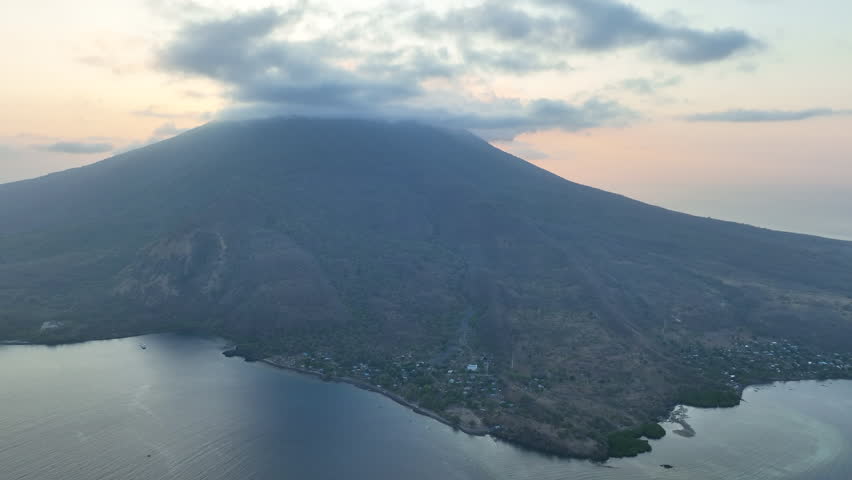 Evening light illuminates the volcano of Iliape on the island of Lembata in Indonesia. This active volcano, within the Lesser Sunda Islands, is part of the Ring of Fire and the Coral Triangle.