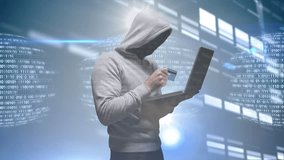Hooded figure holding credit card and laptop over binary code and digital data. Cybersecurity, hacking, fraud, identity theft, internet, cybercrime - Powered by Shutterstock - Get 15% off with code: PIKWIZARD15